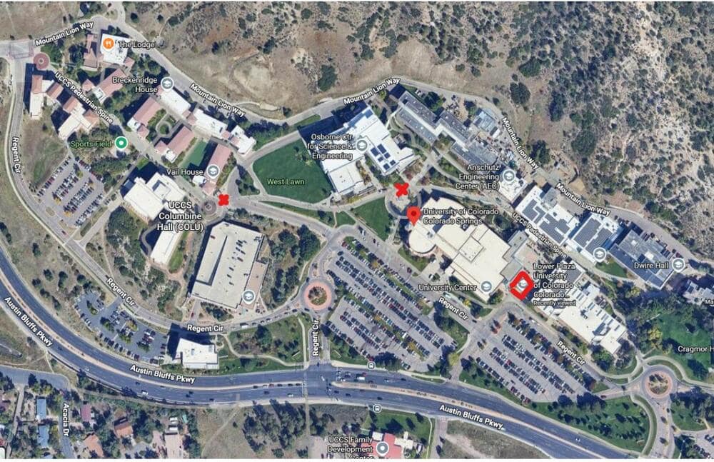 Satellite map of the UCCS campus with two red X marks near Columbine Hall and the Osborne Center, and a red diamond outline over the Lower Plaza.